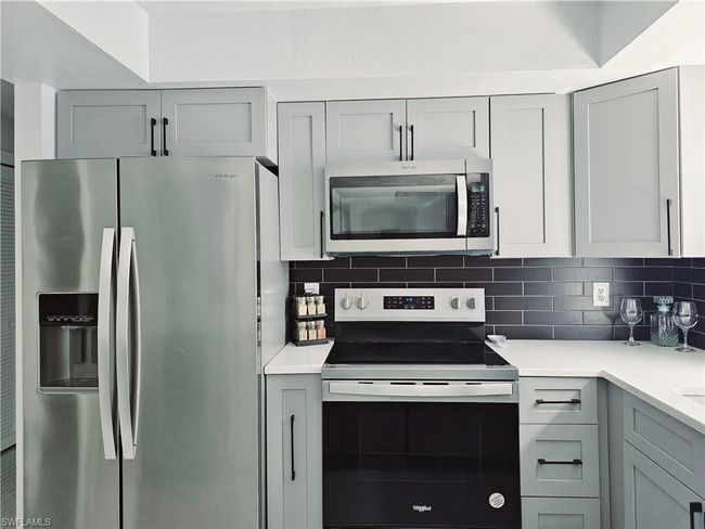 Kitchen featuring appliances with stainless steel finishes and gray cabinetry | Image 15