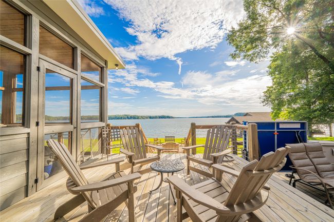 Wooden terrace featuring a water view | Image 6