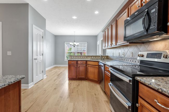 Spacious Kitchen With All Granite Countertops | Image 9