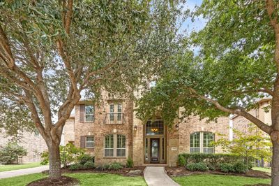 Traditional Trendmaker home on a quiet street backing to a greenbelt. | Image 1