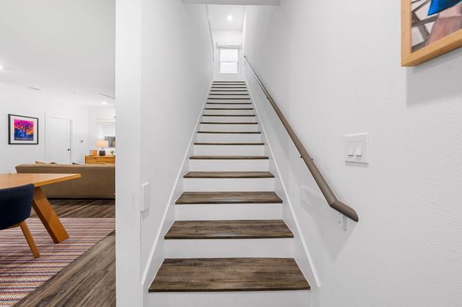 Stairway featuring wood finished floors and recessed lighting | Image 17