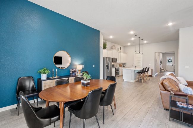Dining room featuring light wood-style flooring and recessed lighting | Image 12