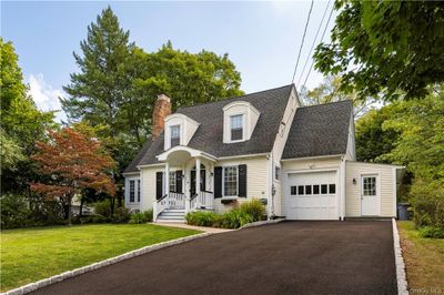 Cape cod home with a garage and a front yard | Image 2