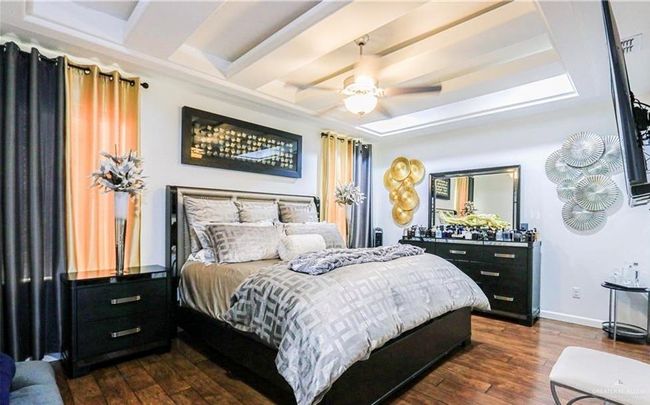 Bedroom featuring ceiling fan and dark wood-type flooring | Image 9