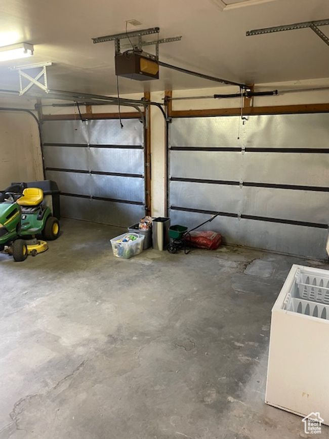 Garage with a garage door opener | Image 29