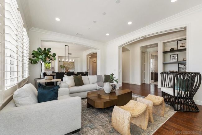 Gorgeous molding beautifully frames the entry to the living and dining rooms. | Image 5