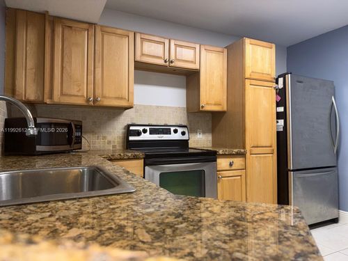 103-8901 Wiles Rd, Coral Springs, FL, 33067-1870 | Card Image