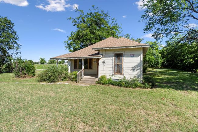 View of front of house with a front yard, covered porch, and roof with shingles | Image 4