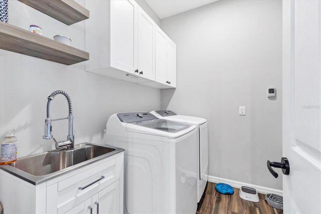 Laundry leading out to garage | Image 32