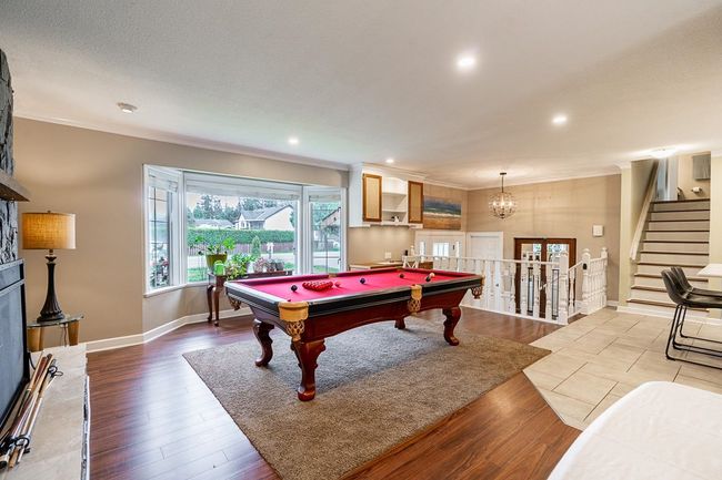 Main Living room featuring crown molding, wood finished floors | Image 13