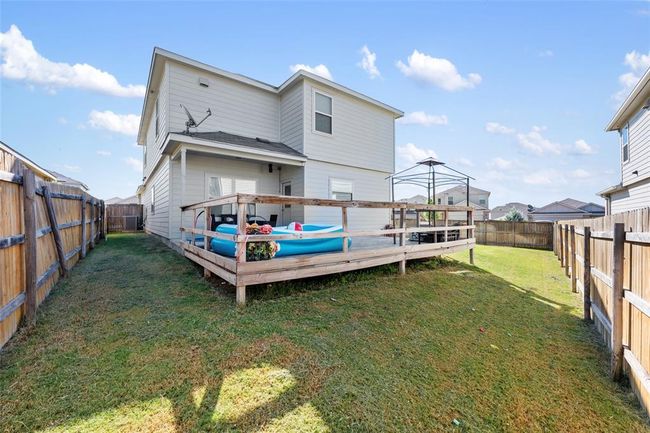 Rear view of house featuring a wooden deck | Image 32
