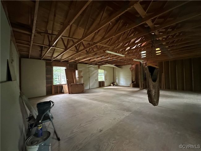 Misc room featuring a garage | Image 4