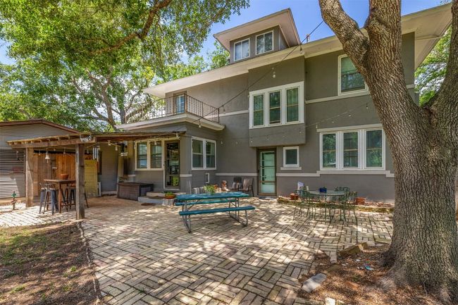 Back of property featuring a balcony, stucco siding, and a patio | Image 34