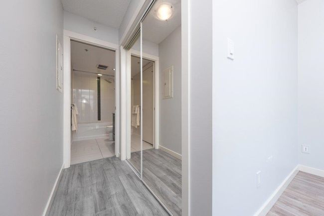 Corridor featuring baseboards and wood finished floors | Image 14