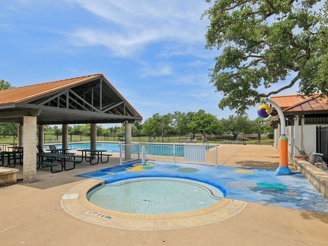 Community pool with a gazebo, fence, and a patio area | Image 36