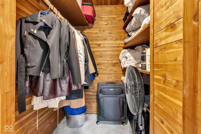 Spacious cedar lined walk in closet on second floor between bedrooms. | Image 35