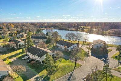 Welcome home to ample green space where nature and tranquility abound, truly a sanctuary home nestled near the shores of Boundary Creek Pond and Boundary creek park...truly a destination townhome community | Image 1