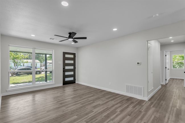 Entryway featuring wood finished floors, baseboards, recessed lighting, and a ceiling fan | Image 4