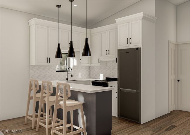 Kitchen featuring wood finished floors, gas stove, a sink, and freestanding refrigerator. Virtual rendering | Image 4