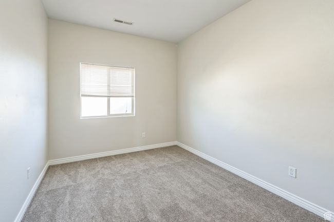 Spare room featuring carpet floors and baseboards | Image 35