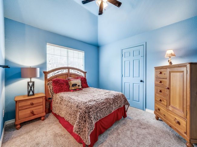 Bedroom featuring carpet floors, extra bonus space in closet and ceiling fan | Image 25