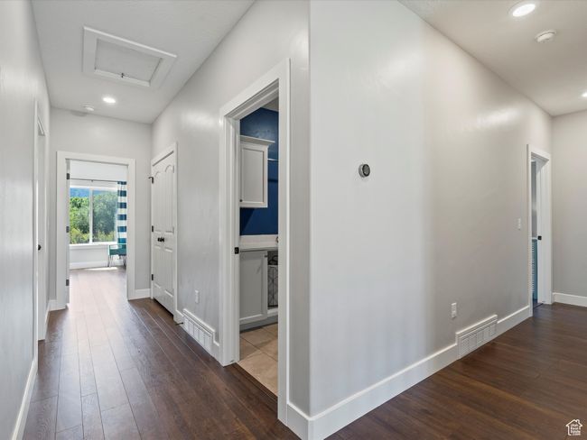 Hallway with dark wood-style floors, attic access, baseboards, and recessed lighting | Image 28