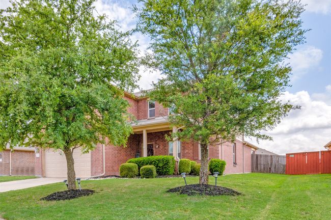 View of front of home featuring nice and neat landscaping. | Image 5