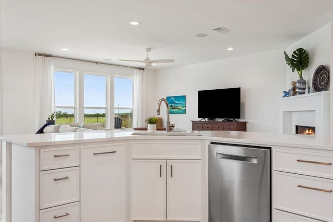 Kitchen featuring dishwasher, open floor plan, a sink, light countertops, and recessed lighting | Image 18