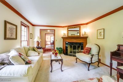 Living room featuring light carpet and crown molding | Image 3