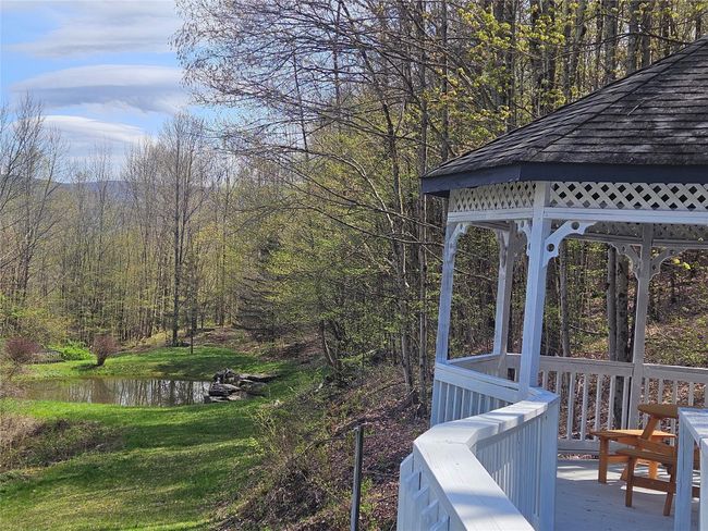 View of yard featuring a gazebo, a view of trees, and a water view | Image 5