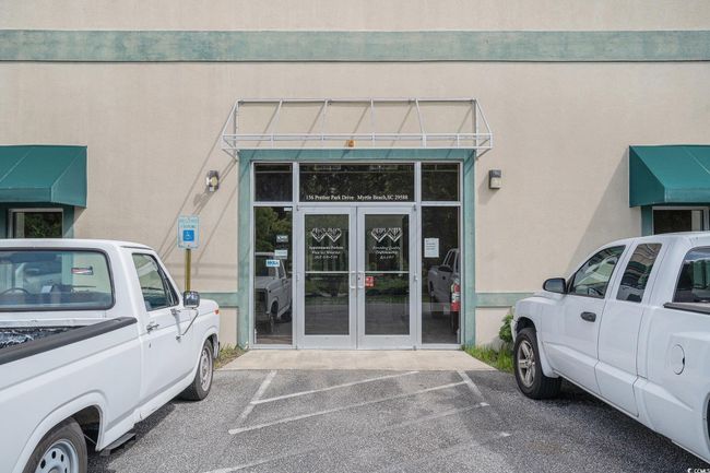 Property entrance featuring french doors, uncovered parking, and stucco siding | Image 4