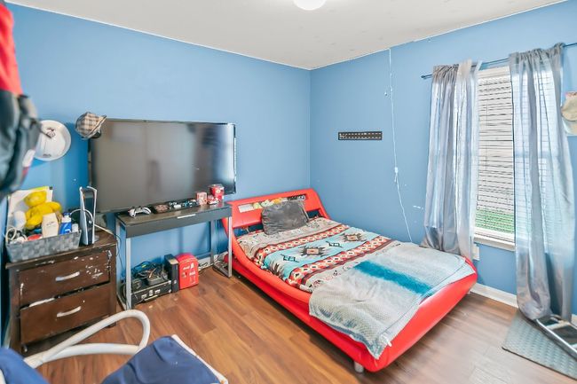 Bedroom with hardwood / wood-style floors | Image 14