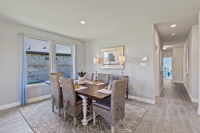 Dining area with light wood finished floors and recessed lighting | Image 9