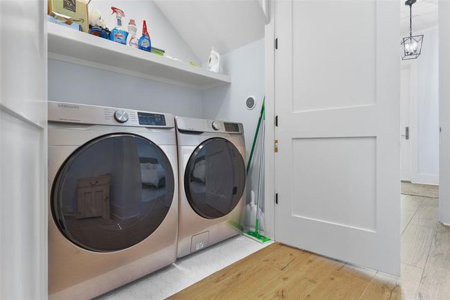 Utility closet with full-size washer and dryer. | Image 32
