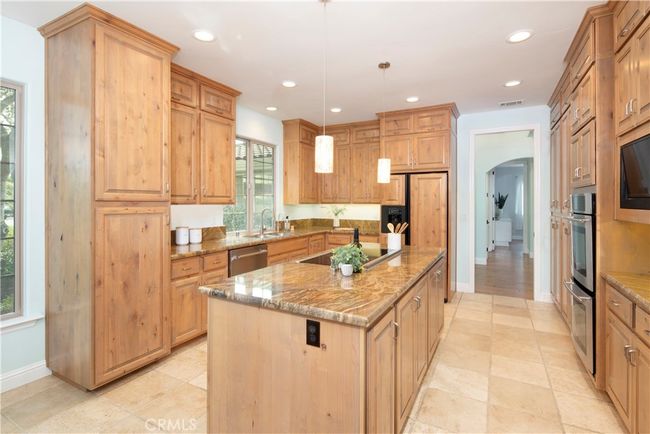Spacious kitchen with custom floor to ceiling cabinets complete with pull out drawers | Image 15