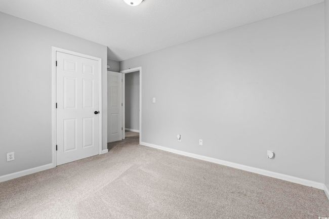 Unfurnished bedroom with carpet and baseboards | Image 17