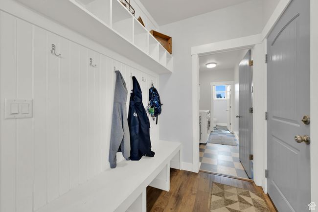 Mudroom featuring independent washer and dryer and dark wood-type flooring | Image 28