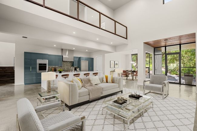 Living room with a high ceiling, recessed lighting, and baseboards | Image 4