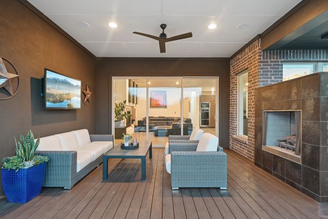 Wooden deck featuring an outdoor living space and ceiling fan | Image 29