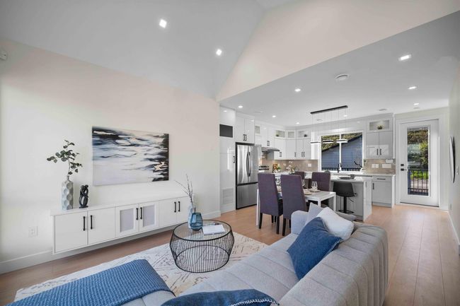 Living room featuring recessed lighting, light wood-style flooring, and vaulted ceiling | Image 11