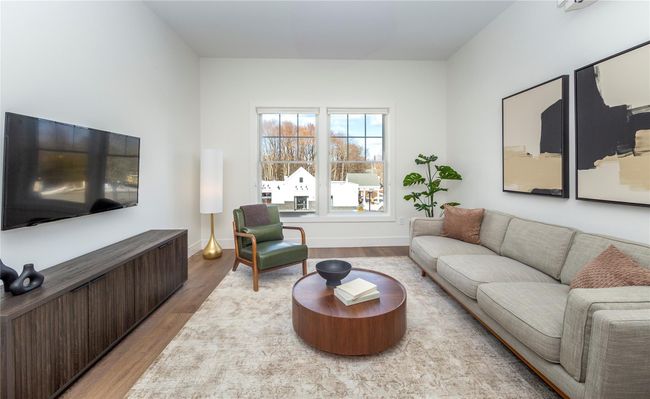 The spacious living rooms are bathed in natural light from oversized windows. | Image 19