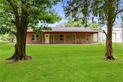 View of front of house featuring a front lawn | Image 1