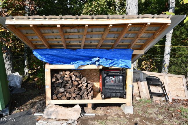 dry wood shed and storage for generator to run full electric on the the two buildings on top of the mountain | Image 74
