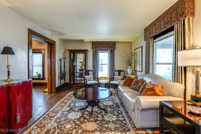 Living area with wood finished floors and baseboards | Image 8