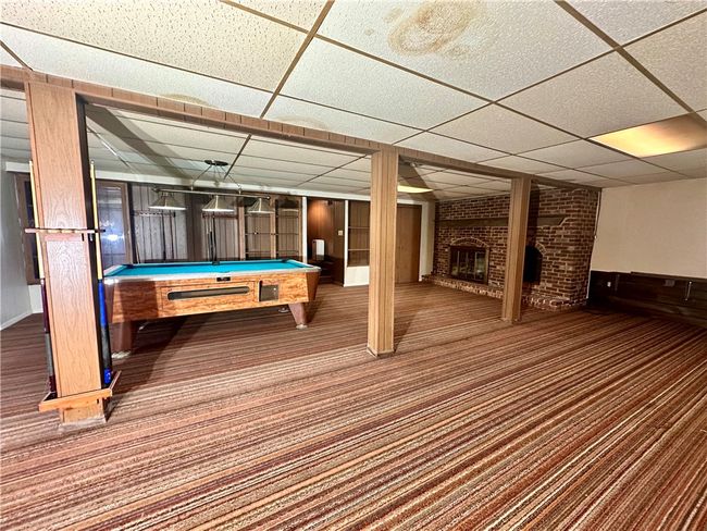 Large game room and fireplace that would be the perfect mancave | Image 27