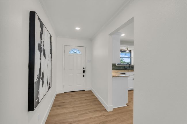 Entrance foyer with light wood finished floors, baseboards, ornamental molding, and recessed lighting | Image 11