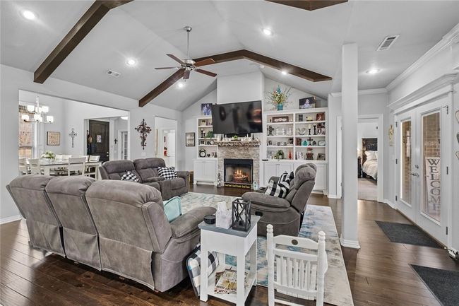 Gas logs, tall ceilings and beautiful floors are just a few of the things that makes this house so inviting. | Image 17