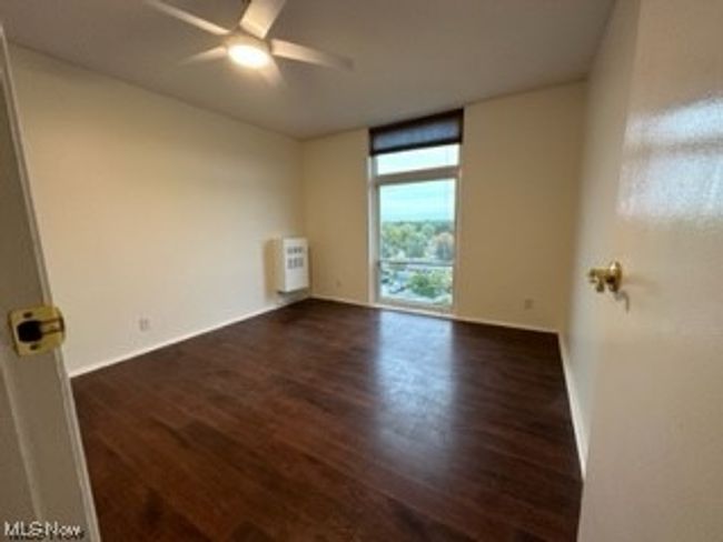 Wood floored empty room with ceiling fan | Image 16