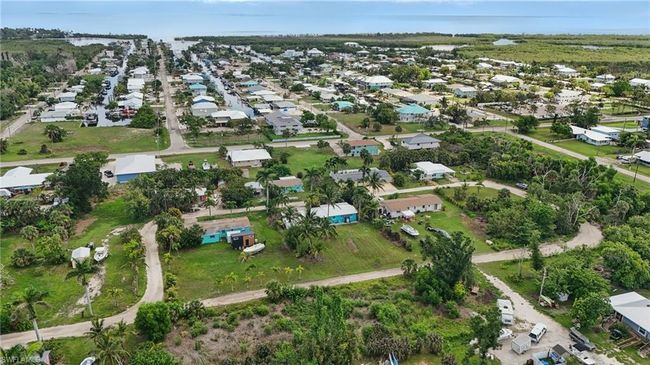 Aerial overview of property's location with nearby suburban area | Image 42