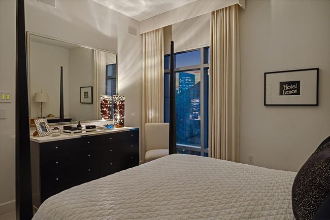 The primary bedroom currently has a queen sized bed, but a king fits comfortably with smaller side tables. There is also room for a comfy chair by the window. | Image 16